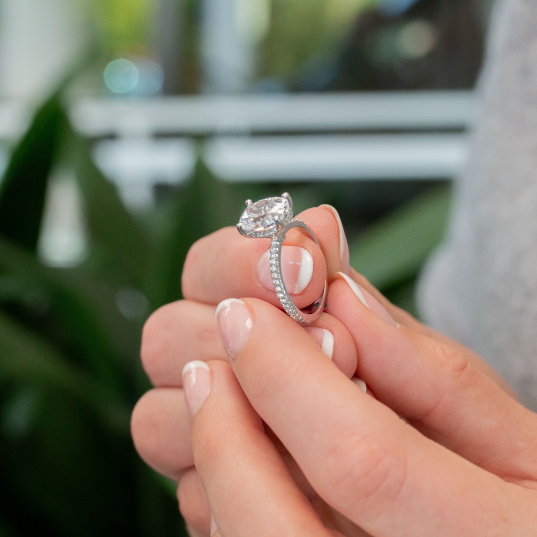 woman holding an engagement ring