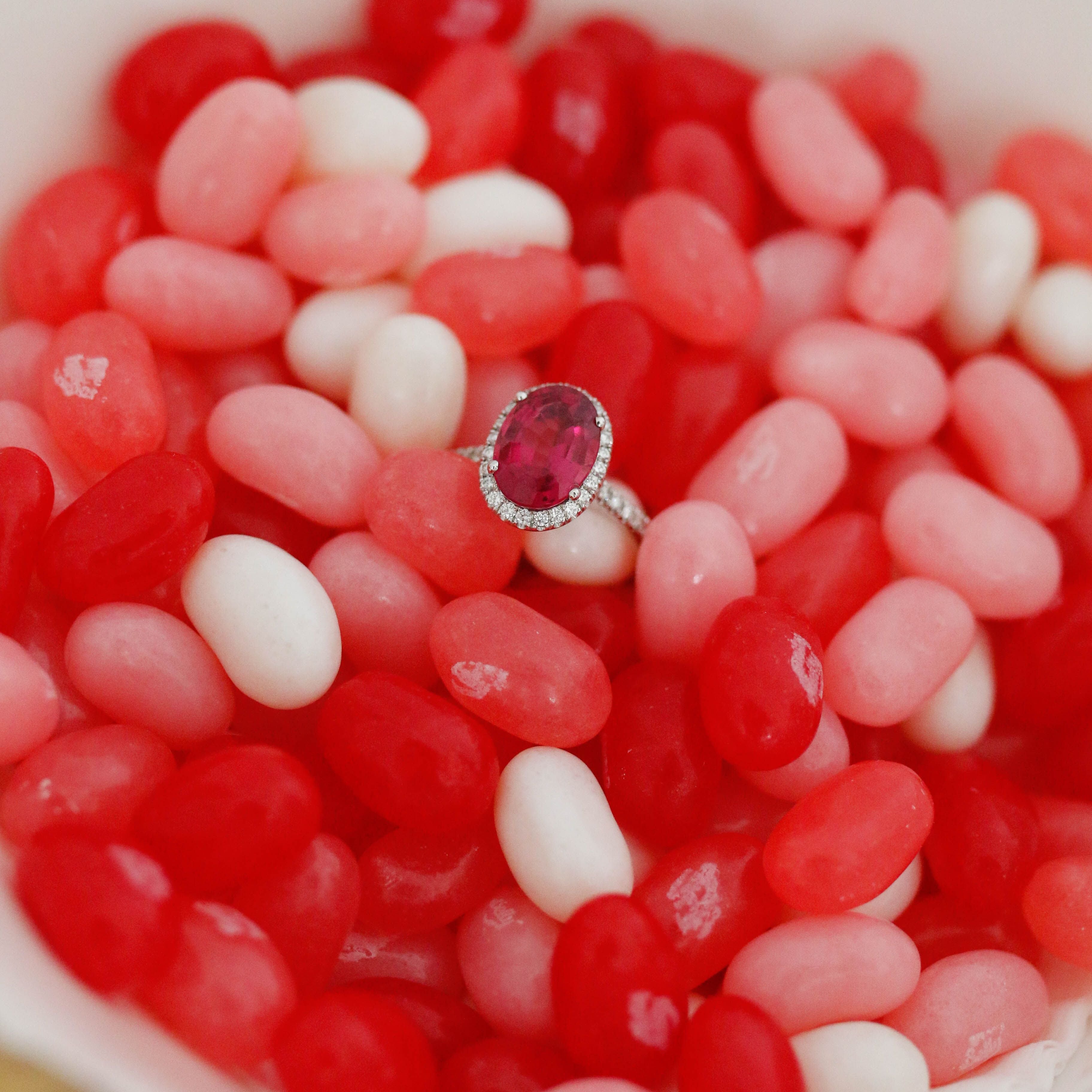 A stunning ruby and diamond engagement ring, set in a delicate band, symbolizing love and passion—perfect for a Valentine’s Day proposal