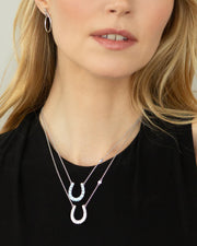 2.56ct Blue Sapphire, 2.29ct Blue Topaz and Mother of Pearl Horseshoe Pendant in Sterling Silver, 18" chain