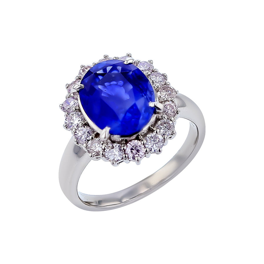 5.17ct Oval Blue Sapphire and 1.09ct Diamond Halo Ring in Platinum Circa 1970s Size 8