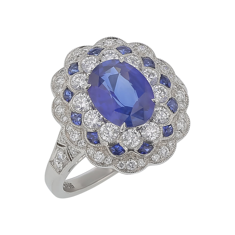 2.05ct Oval Sapphire, 0.15ct Sapphire and 0.81ct Diamond Halo Ring in Platinum, Size 6.5